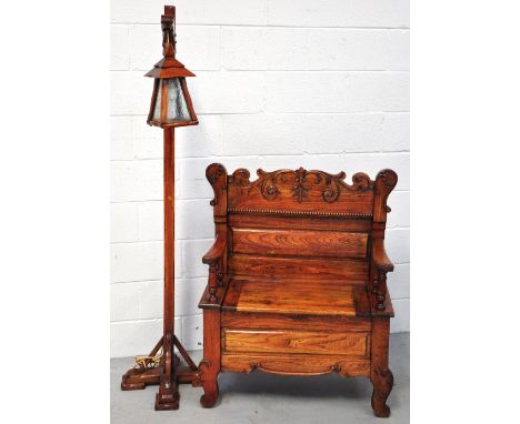 A 20th century carved oak box seat hall chair with lift-up seat retailed by W.Harding of Liverpool, width 80cm and a further 