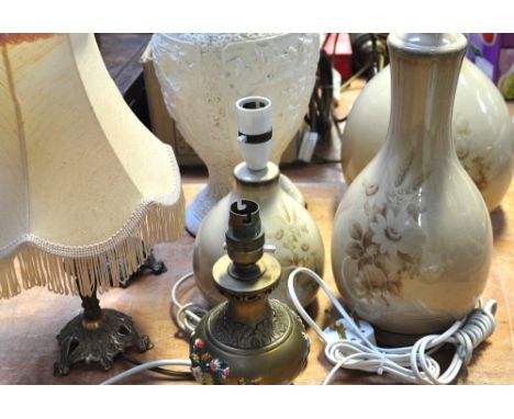 A standard lamp and various table lamps.