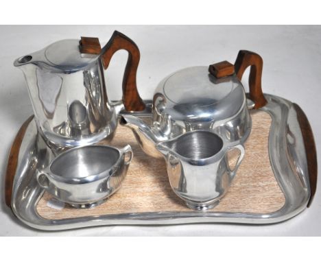 A retro Picquot ware tea service to include tray, tea pot, coffee pot, milk and sugar. CONDITION REPORT No visible signs of d