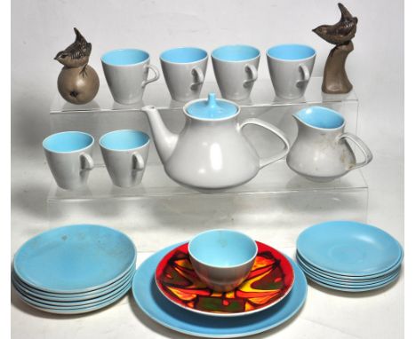 A Poole pale blue tea service to include plates, tea cups, tea pot etc, two Poole birds and a Poole decorative plate.