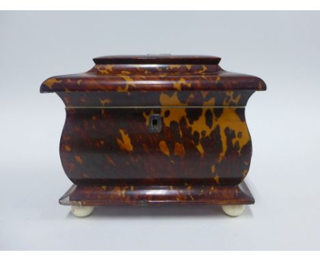 Georgian tortoiseshell and ivory tea caddy of sarcophagus form, the hinged lid opening to reveal two lead lined compartments 