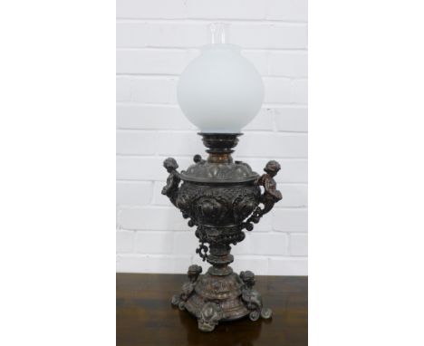Oil lamp with cherubs and figures, opaque glass shade,  68cm.