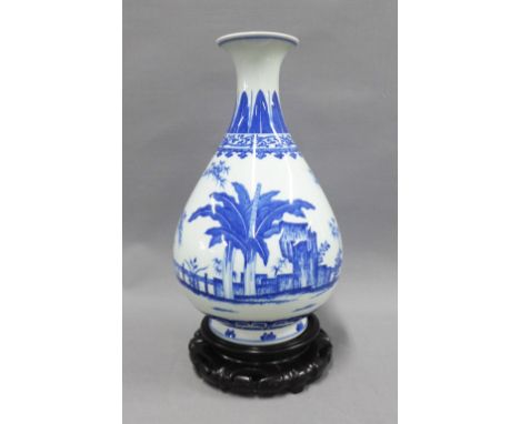 Chinese blue and white vase with printed Qianlong seal mark to  the base, but likely  later, on a wooden base, 34cm 