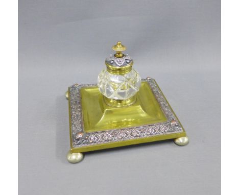 Brass and mixed metal desk inkstand of square outline, with a glass inkwell, on bun feet, 16cm 