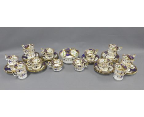 English porcelain tea set with two cake plates, slop bowl, twelve large cups, twelve smaller cups and eighteen saucers (slop 