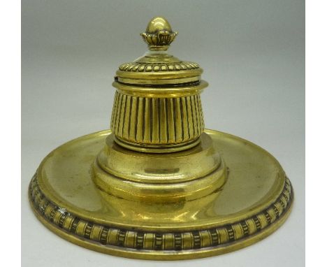 A Victorian brass inkwell