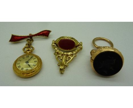 A plated swivel fob, a plated seal and a Ritma gilt metal and enamel lapel watch