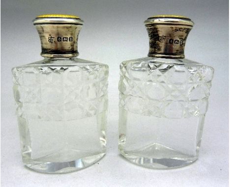 A pair of silver topped and guilloche enamel scent bottles, Birmingham 1924