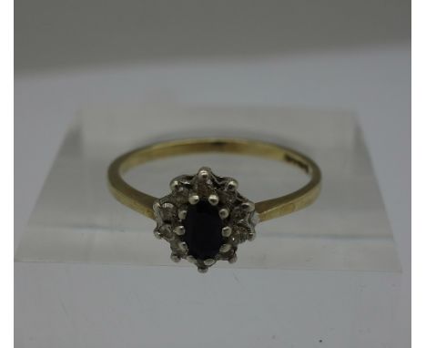 A 9ct gold, diamond and sapphire ring, weight 1.5g, size M