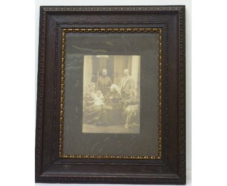 An oak framed albumen print of Queen Victoria and family