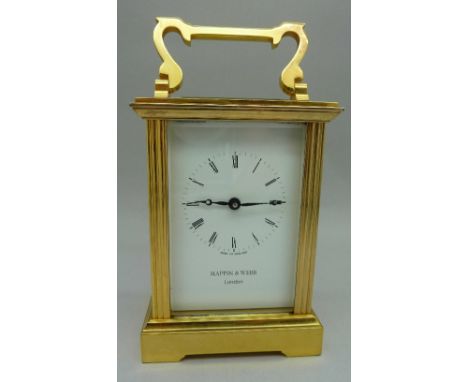 A Mappin & Webb brass four glass sided carriage clock