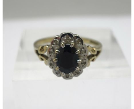 A 9ct gold, diamond and sapphire cluster ring, weight 2.5g, size M