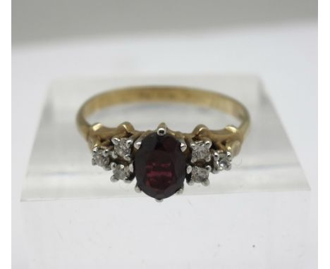 A 9ct gold, garnet and white stone ring, weight 2.5g, size R