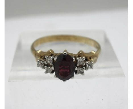 A 9ct gold, garnet and white stone ring, weight 2.5g, size R