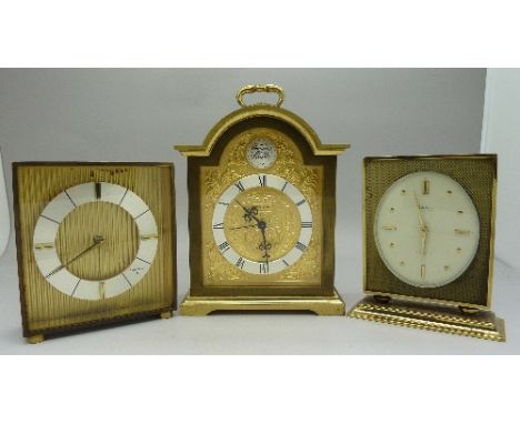 A Swiza break-arch top gilt brass mantel clock with alarm, signed 'Tempus Fugit and two other Swiza clocks