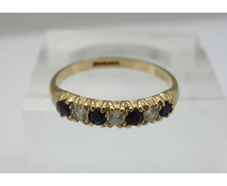 A 9ct gold, sapphire and white stone ring, weight 1.3g, size N