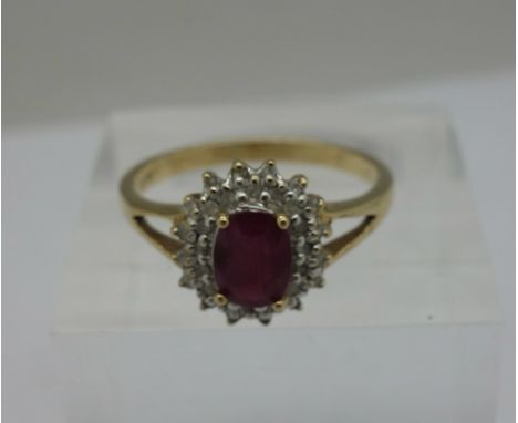 A 9ct gold, ruby and white stone ring, weight 2.7g, size P