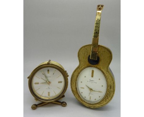 Two Swiza novelty clocks, a guitar shaped clock with musical alarm and a drum shaped clock