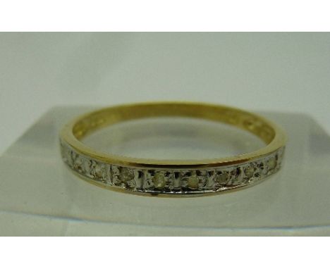 A 9ct gold and diamond eternity ring, weight 1.0g, size O