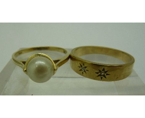 A 9ct gold and three stone diamond ring, size M and a 9ct gold and pearl ring, size L, weight 3.8g