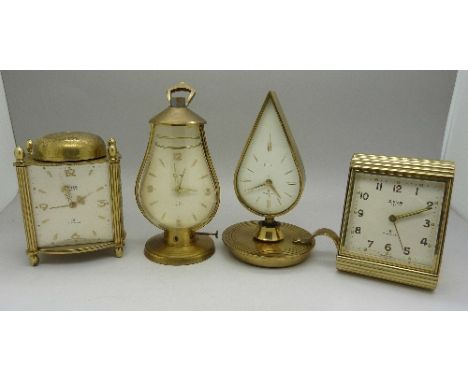 Four Swiza novelty clocks, chamber stick, lantern and two others