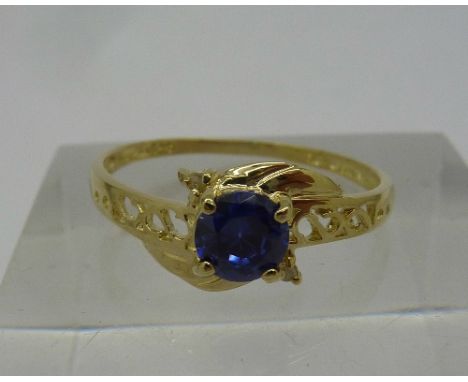 A 9ct gold and blue stone ring, weight 1.1g, size N