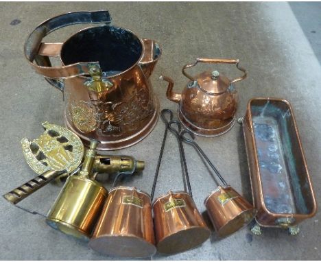A brass Bladon blow lamp and assorted copper items including a kettle, graduated measuring jugs, etc.