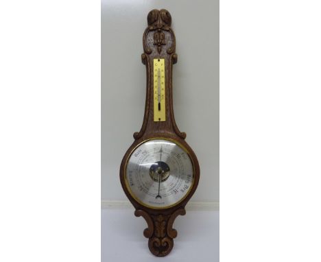 A carved oak barometer, height 53cm