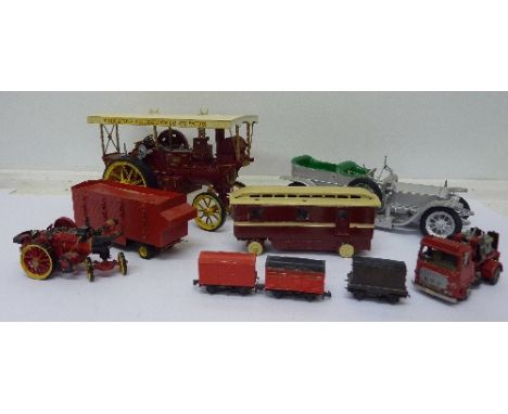 A die-cast steam motor traction engine, a model of a vintage car, etc.