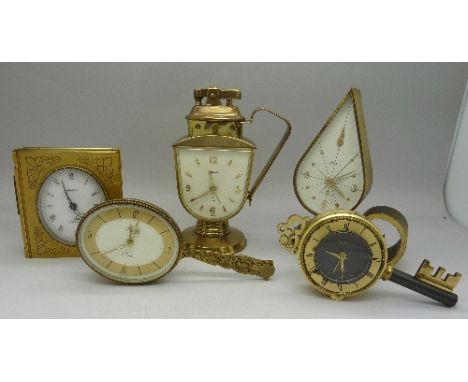 Five Swiza novelty clocks, one with lighter, also book, key, frying pan and chamber stick