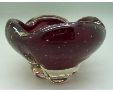 A Whitefriars ruby red lobed molar bowl with encased bubbles, designed by Geoffrey Baxter, pattern no. 9409 from 1957 catalog