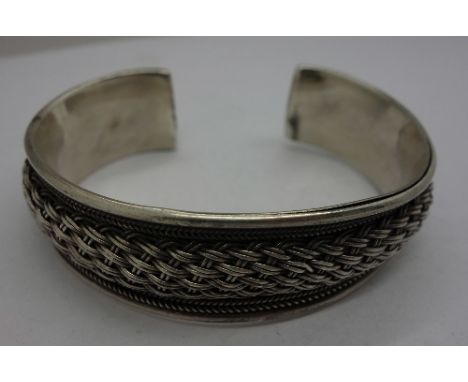 A silver bangle, weight 50g