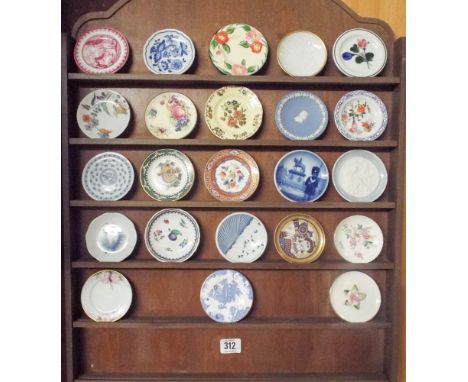 Wall mounted plate rack and a collection of miniature wall plates to include examples by Royal Copenhagen and Worcester 