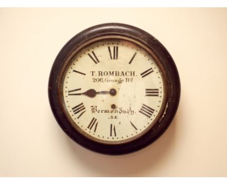 A circular school type wall clock by T Rombach Bermondsey 