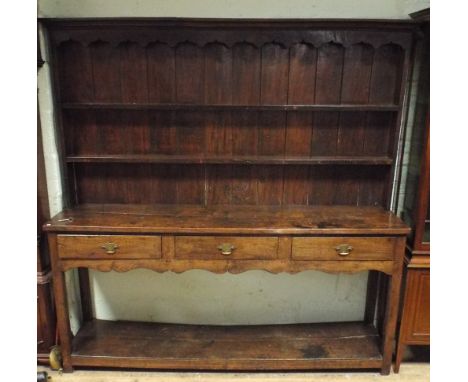 A 6'6 antique oak dresser with shelf back fitted 3 drawers with pot board under 
