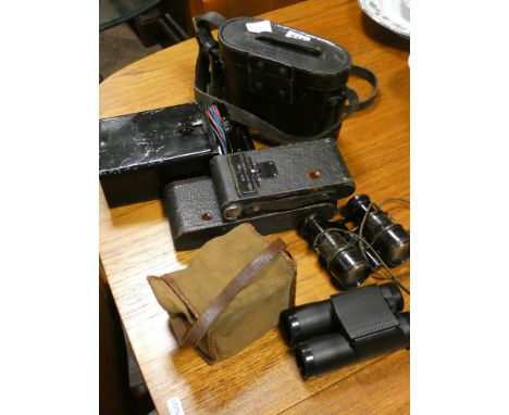A group of prismatic binoculars, box camera etc     1. Rega 644526 2. No signs of make & model3. UK design reg. 2032504 
