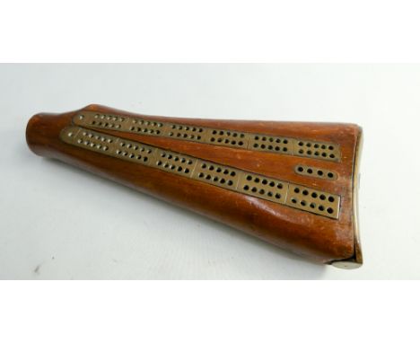 Cribbage scoreboard with pegs in a rifle butt from the Bays Regiment 