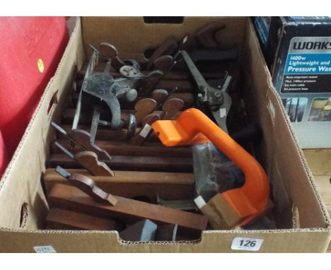 A large box mostly old woodworking planes and other hand tools 