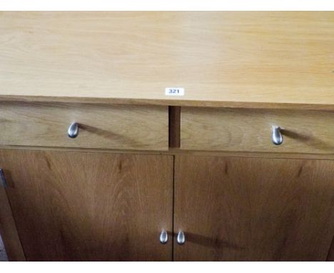 A light oak cabinet fitted 1 drawer and 2 doors under 