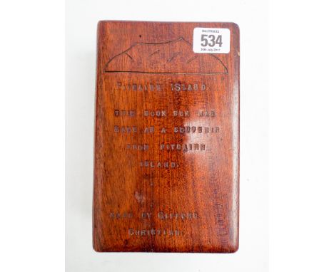A small wooden box made in the form of a book 8" x 5" inscribed Pitcairn Island this book box was made as a souvenir from Pit