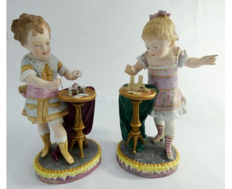 A pair of Paris coloured bisque figurines of girls playing cards, anchor mark and marked DCTL height 22cms tall      Generall