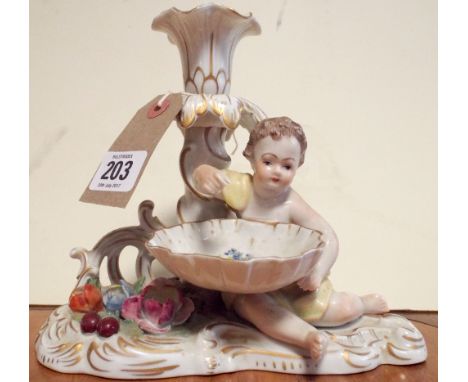 Dresden cherub figural candlestick with blue printed marks beneath 