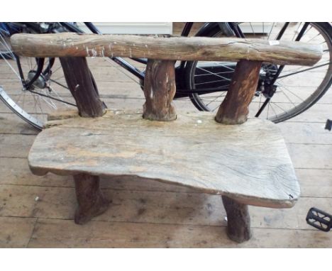 A rustic 2 seater garden bench