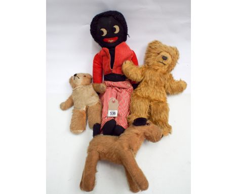 A collection of 4 soft toys to include 2 Teddy bears, a golly and a fox terrier
