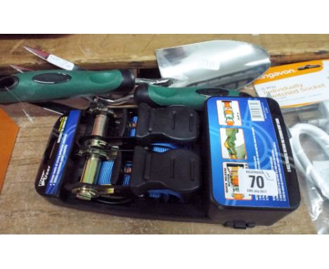 A new 2 piece ratchet tie down strap set and a new stainless steel garden hand fork and trowel 