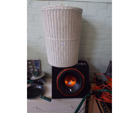 An Edge Street large 900watt car speaker and a laundry basket 