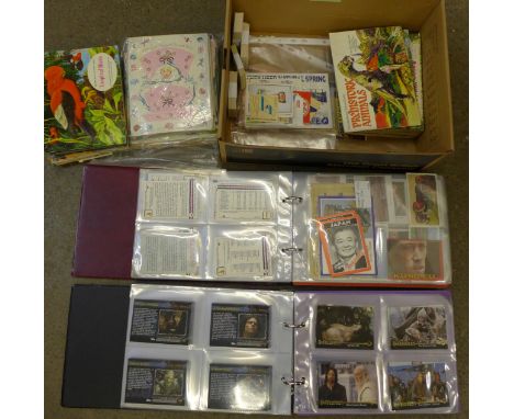 Two modern albums of trade cards, some full sets, type cards and tea cards, Barratt, Topps, etc., and vintage greetings cards