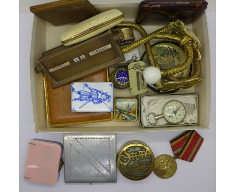 A perpetual brass desk calendar, curtain tie-backs, cigarette cases, etc.