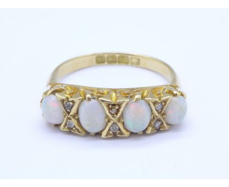A Victorian 18ct gold, opal and diamond ring, 4.6g, L