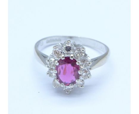 An 18ct gold, ruby and diamond cluster ring, Birmingham 1976, diamond weight 0.50ct, ruby content 0.75ct, 4g, O½